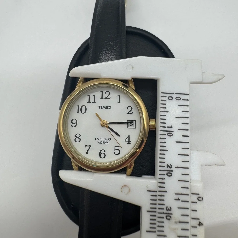 Timex Indiglo WR 30M Gold Tone White Dial Black Leather Watch CR 1216 needs bat